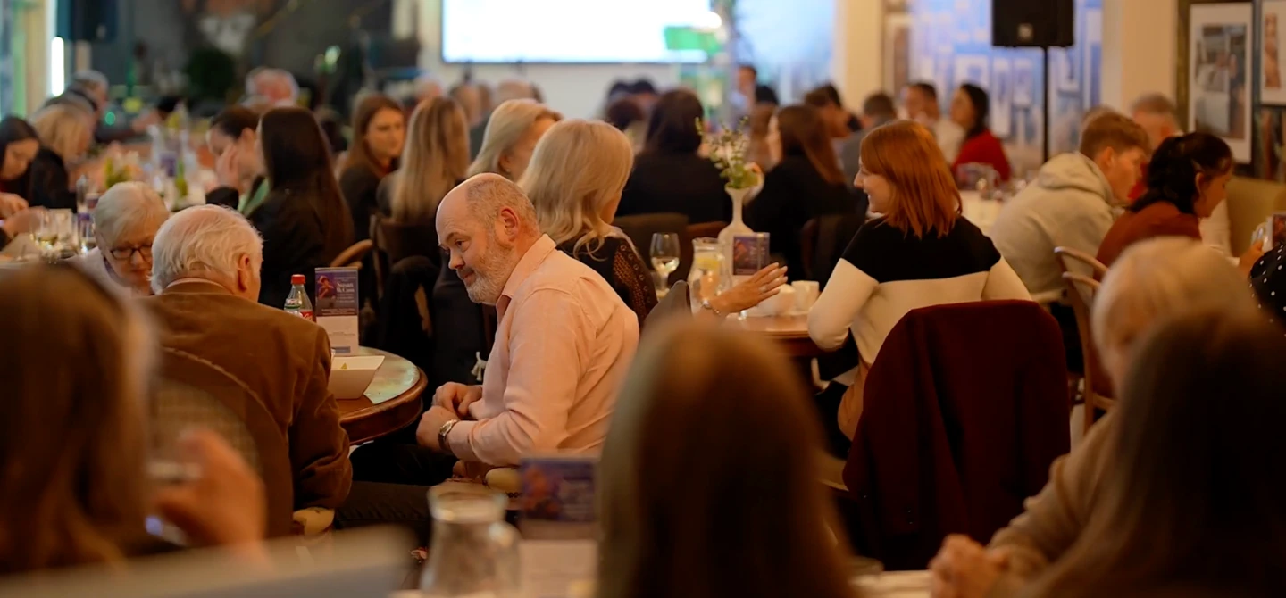 people eating at group event