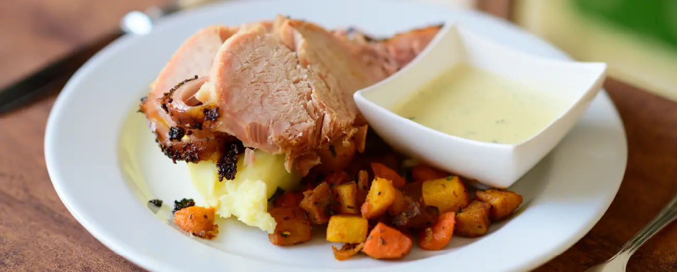 Baked ham, vegetable and parsley sauce