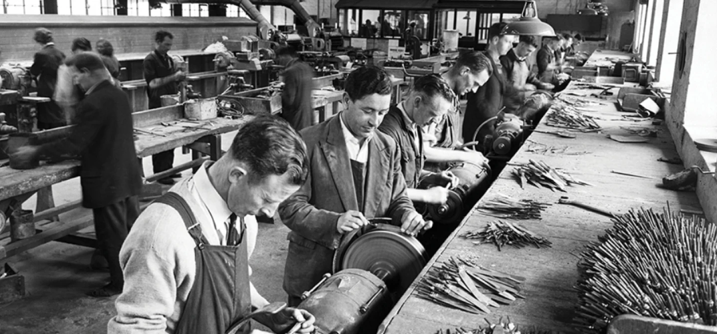 Workers making cutlery